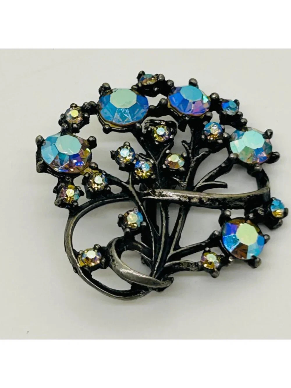 Vintage Aurora Borealis Rhinestone Brooch Peacock Colored Pin Gunmetal